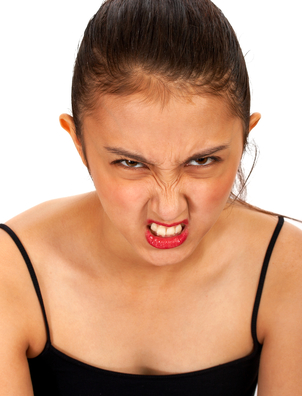 Angry Asian Girl Pulling A Face